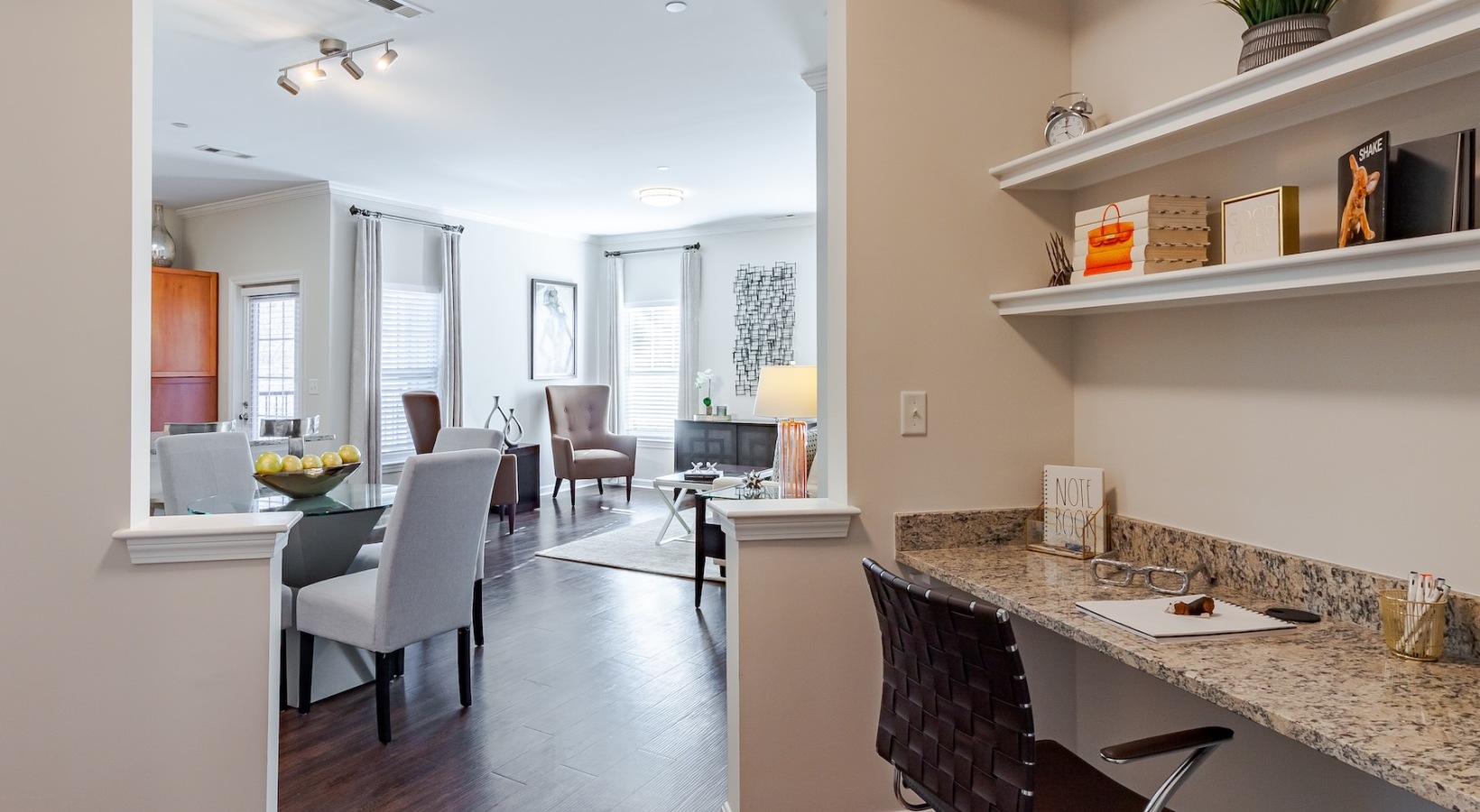 an office area with a desk and a chair
