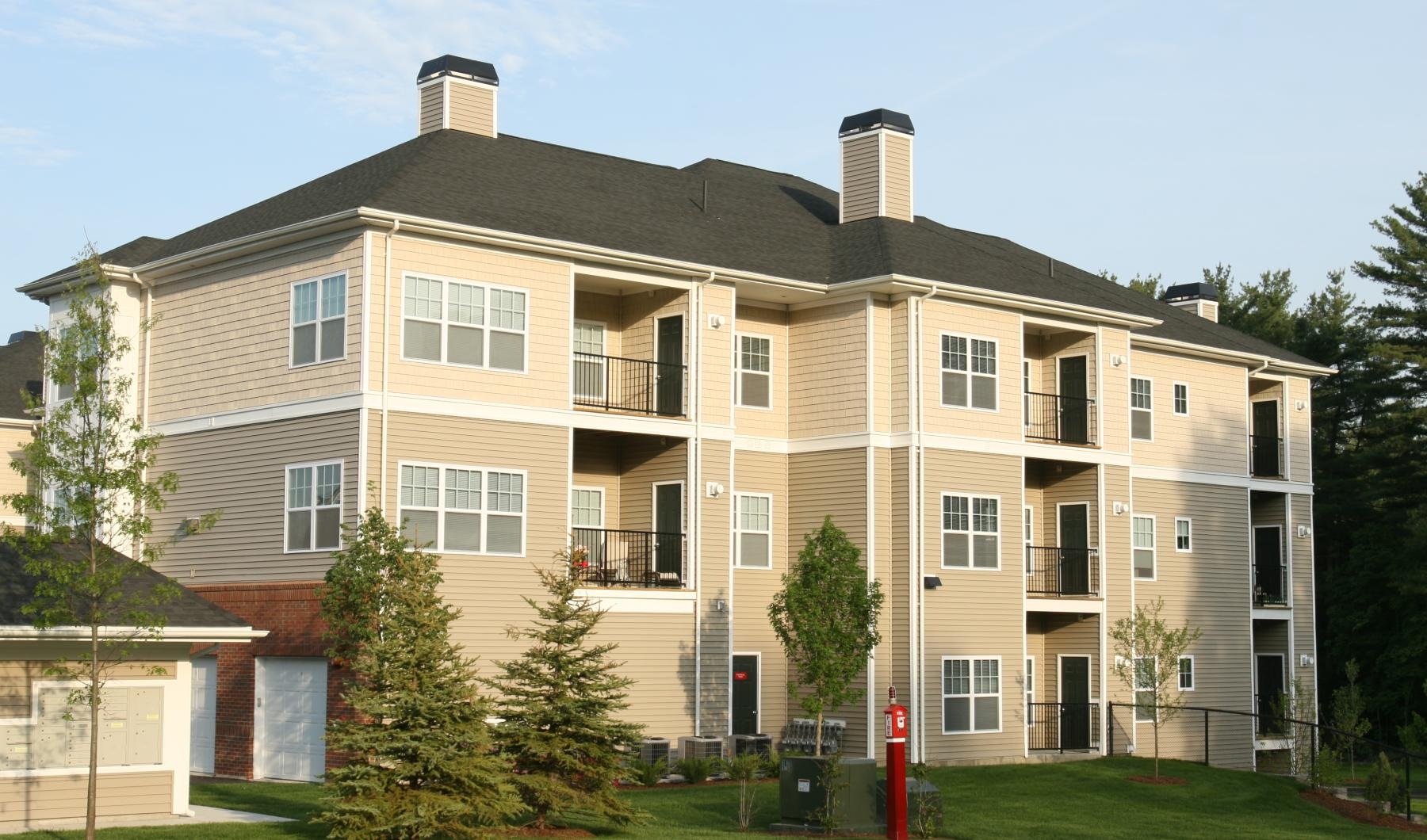 a large building with trees in front of it